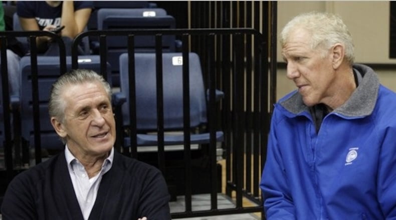 In this file photo, former NBA superstar Bill Walton (right) chats with Miami Heat general manager Pat Riley.