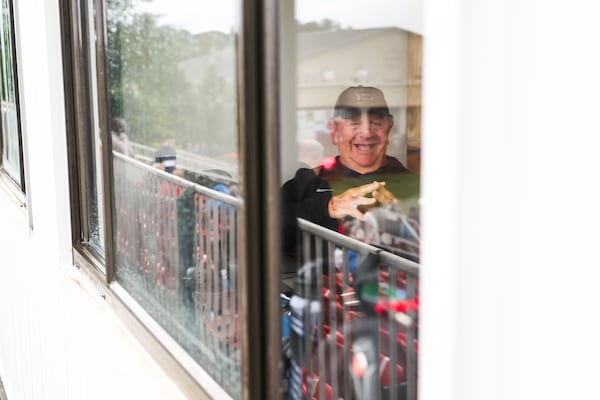 Putnam County assistant coach Charlie Winslette sits in the visiting coaches box at Morgan County High School in Madison, on Friday, Aug. 22, 2025. “There’s nothing any more exciting than a high school football Friday night,” he says. (Abbey Cutrer/AJC)
