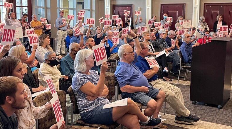 More than 50 residents packed into Tuesday's meeting of Suwanee City Council to protest a proposed zoning amendment. (Tyler Wilkins / tyler.wilkins@ajc.com)