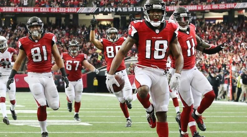 Falcons wide receiver Taylor Gabriel scores a 35-yard touchdown against the Cardinals for a 17-10 lead during the second quarter in an NFL football game on Sunday, Nov. 27, 2016, in Atlanta. Curtis Compton/ccompton@ajc.com