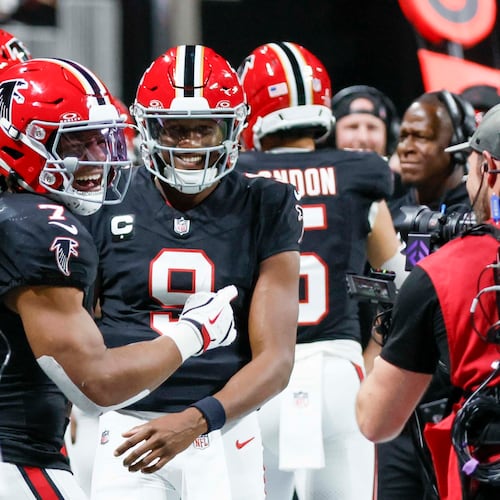 Falcons' running back Bijan Robinson continues to be dominant, which has allowed quarterback Michael Penix Jr. to not have to do too much. (Miguel Martinez/AJC)