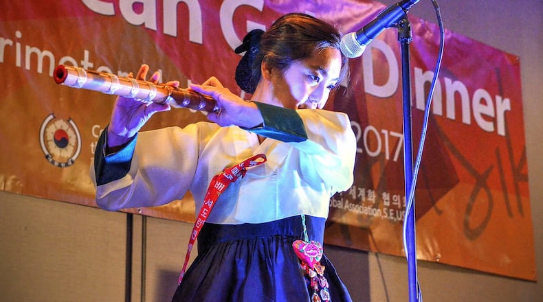 Joyce Ham plays the DaeGeum (Korean woodwind) for attendees of a five-course dinner event introducing metro Atlantans to “Chuseok,” an annual harvest feast similar to America’s Thanksgiving celebration. The Consulate General of the Republic of Korea in Atlanta invited more than 100 influential guests from Georgia — including lawmakers, business executives and food bloggers — to the dinner to experience Korean food and culture and celebrate the Chuseok holiday. The gala was held Oct. 5, 2017, at the Westin Atlanta Perimeter North.