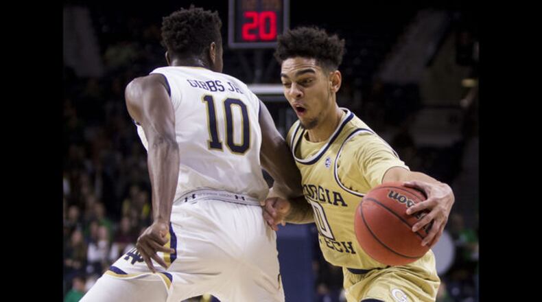 Georgia Tech's Michael Devoe (right) moves by Notre Dame's T.J. Gibbs Jr. (10) during the first half of an NCAA college basketball game Sunday, Feb. 10, 2019, in South Bend, Ind. (AP Photo/Robert Franklin)