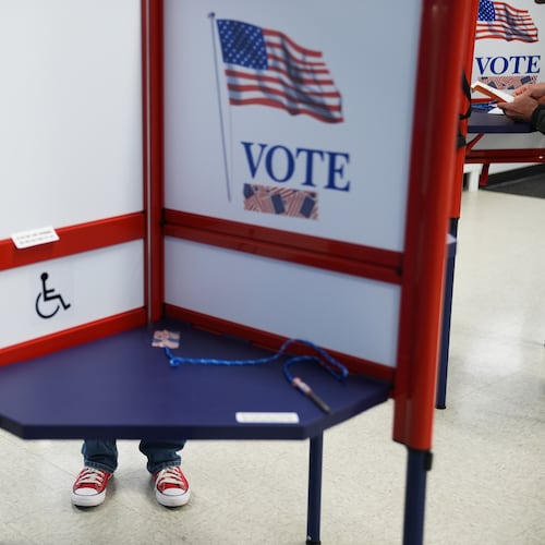 Voters cast their ballots on the first day of early voting in Minnesota at the Elections & Voter Services building, Friday, Sept. 18, 2026, in Minneapolis. (AP Photo/Ellen Schmidt)