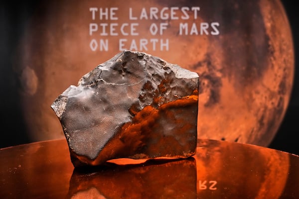 A Martian meteorite, weighing 54.388 lbs. (24.67 kg), said to be the largest piece of Mars on Earth, estimated at $2 - 4 million, is displayed at Sotheby's, in New York, Wednesday, July 9, 2025, part of their Geek Week auction, July 16, 2025. (AP Photo/Richard Drew)