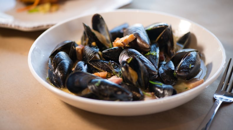 PEI Mussels with pork belly, caramelized onion, and hard cider broth at Bogartz Food Artz. Photo credit- Mia Yakel.