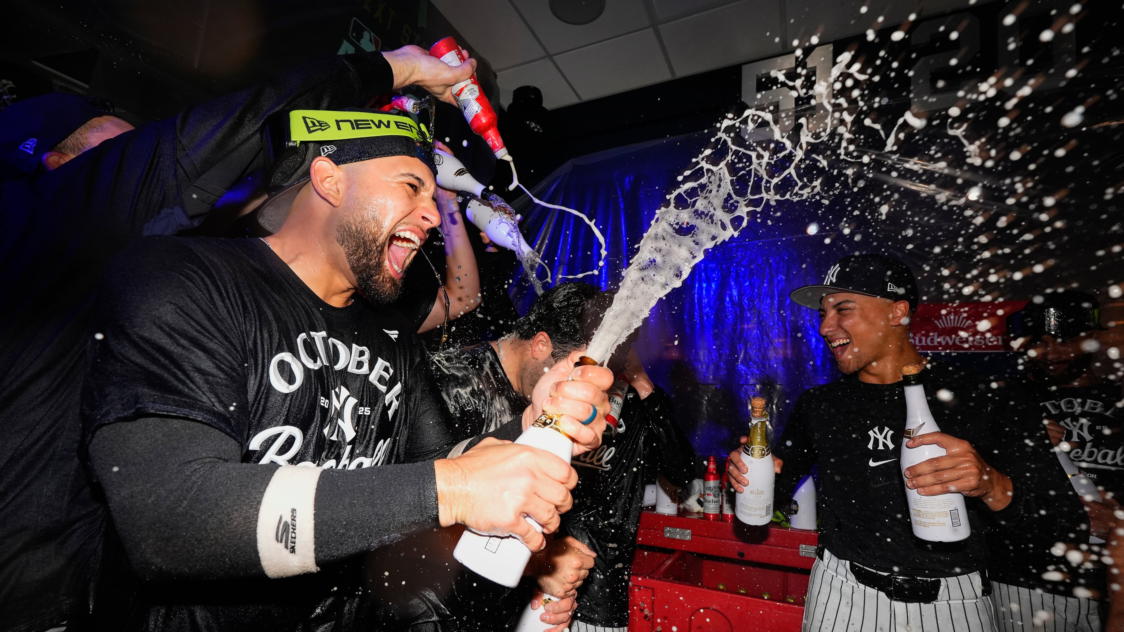 TheNew York Yankees celebrate in the locker room after defeating the Boston Red Sox in Game 3 of an American League wild-card baseball playoff series, Thursday, Oct. 2, 2025, in New York. (AP Photo/Yuki Iwamura)