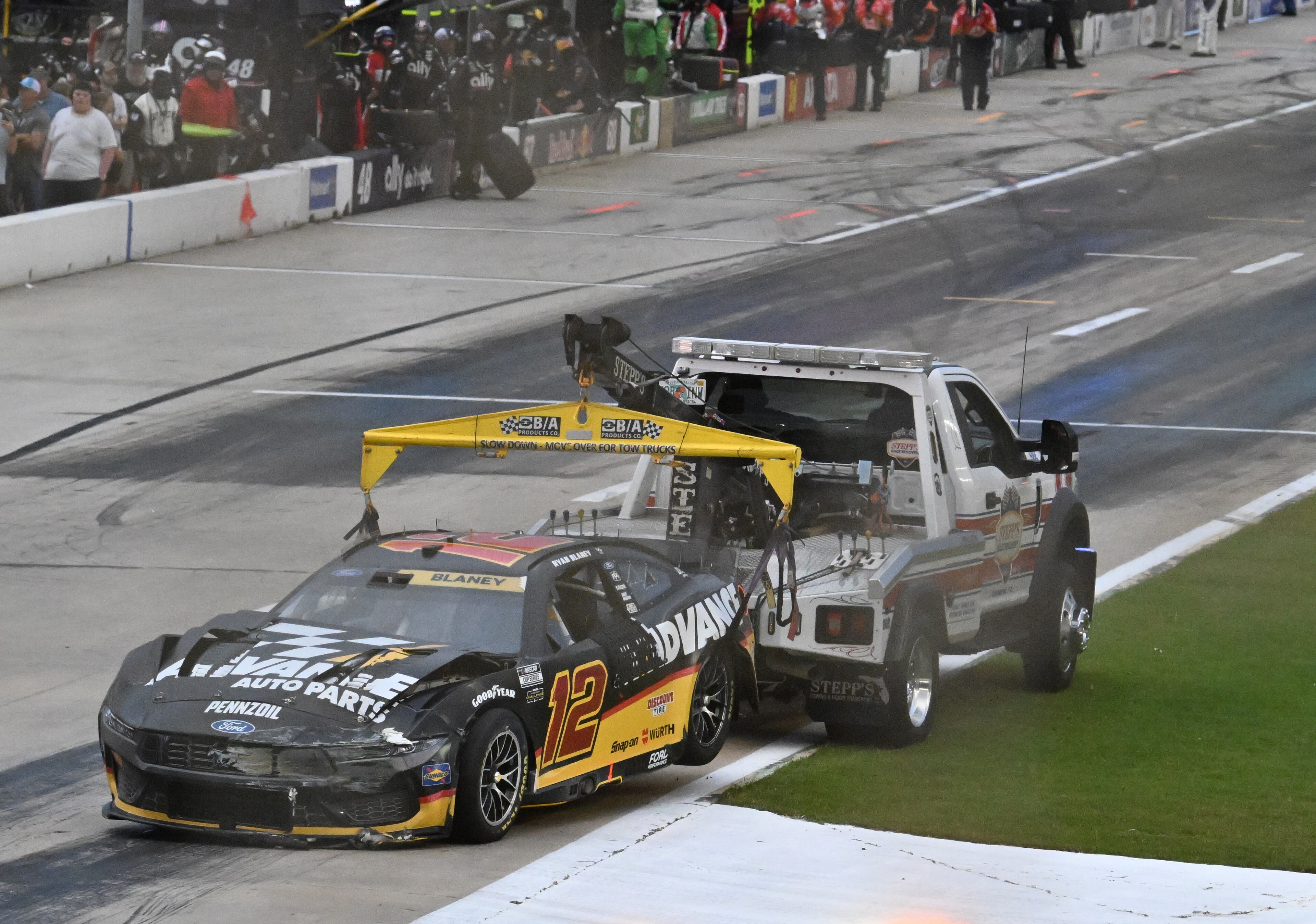 NASCAR Cup Series driver Ryan Blaney’s car is towed after a crash during Quaker State 400 NASCAR Cup Series race at EchoPark Speedway, Saturday, June 28, 2025, in Hampton. (Hyosub Shin / AJC)