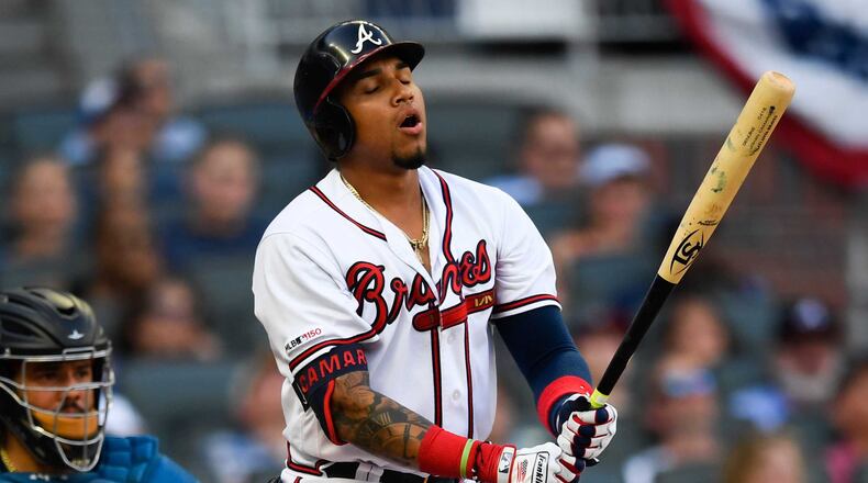 Braves' Johan Camargo reacts after hitting a shallow pop fly to right field for an out during the ninth inning of the team's baseball game against the Miami Marlins, Saturday, July 6, 2019 in Atlanta. Miami won 5-4. (AP Photo/John Amis)