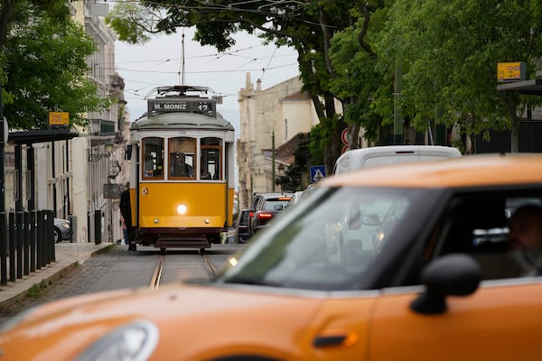An electric tram drives uphill in Lisbon, Tuesday, April 29, 2025, the day after a nationwide power outage that stopped trams, trains and subways. (AP Photo/Armando Franca)