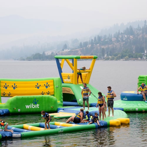 People play at the Peachland Water Park in Peachland, British Columbia, Canada, on Saturday, Aug. 8, 2026. (Gary Nylander/The Canadian Press via AP)