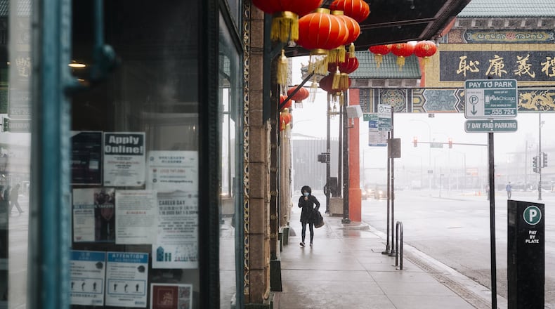 A person walks in Chicago’s Chinatown neighborhood, on Feb. 12, 2020. Though there are only a few known cases in the U.S., the coronavirus outbreak has left some Asian-Americans feeling an unsettling level of public scrutiny. (David Kasnic/The New York Times)