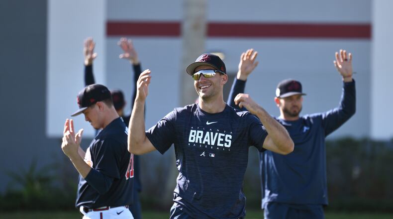 Atlanta Braves first baseman Matt Olson smiles as he warms up with teammates during Braves spring training at CoolToday Park in North Port, Florida. (Hyosub Shin/The Atlanta Journal-Constitution/TNS)