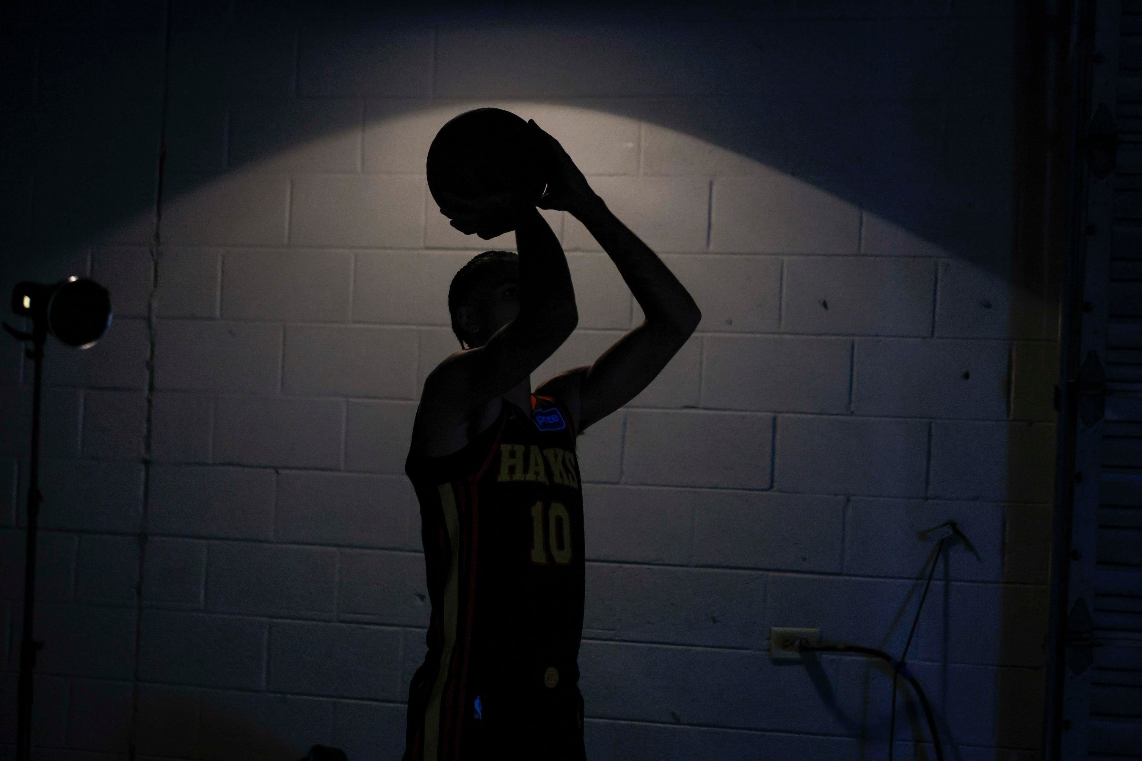 Atlanta Hawks forward Zaccharie Risacher (10) is seen shadowing as he poses for a photo during media day at PC&E Atlanta on Sept. 29, 2025, in Atla
(Miguel Martinez/ AJC)