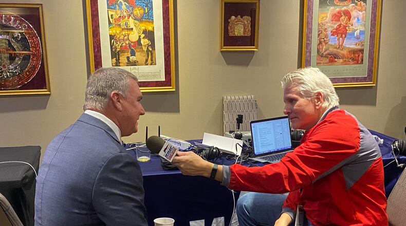 Georgia State coach Shawn Elliott (left) talks with radio host David Schultz of Sports Radio 105.5 in Mobile, Ala.