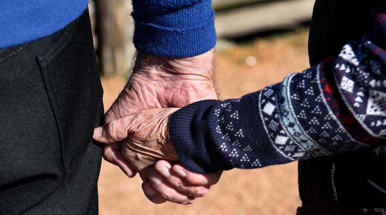 SAN ANTONIO, TEXAS - DECEMBER 10, 2018: An elderly couple walk hand-in-hand in San Antonio, Texas. (Photo by Robert Alexander/Getty Images)