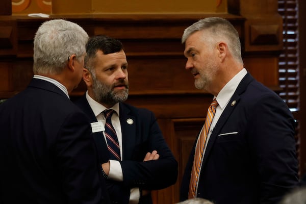 State Rep. Tim Fleming, R-Covington, center, mingles with State Rep. Victor Anderson, R-Cornelia, and State Rep. Stan Gunter, R-Blairsville, during the fifth day of a special legislative session at the Capitol in Atlanta on Tuesday, June 23, 2026. (Miguel Martinez/AJC)