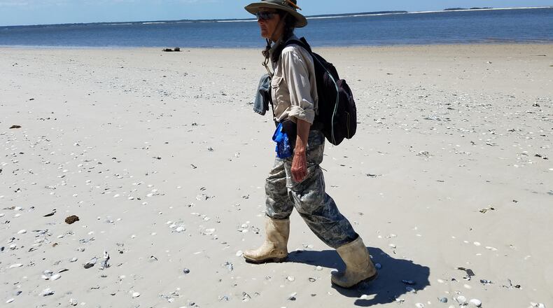 Carol Ruckdeschel walks along the shore of Cumberland Island, which sits across the Intracoastal Waterway from the site of a proposed spaceport in Camden County. Maya T. Prabhu/maya.prabhu@ajc.com