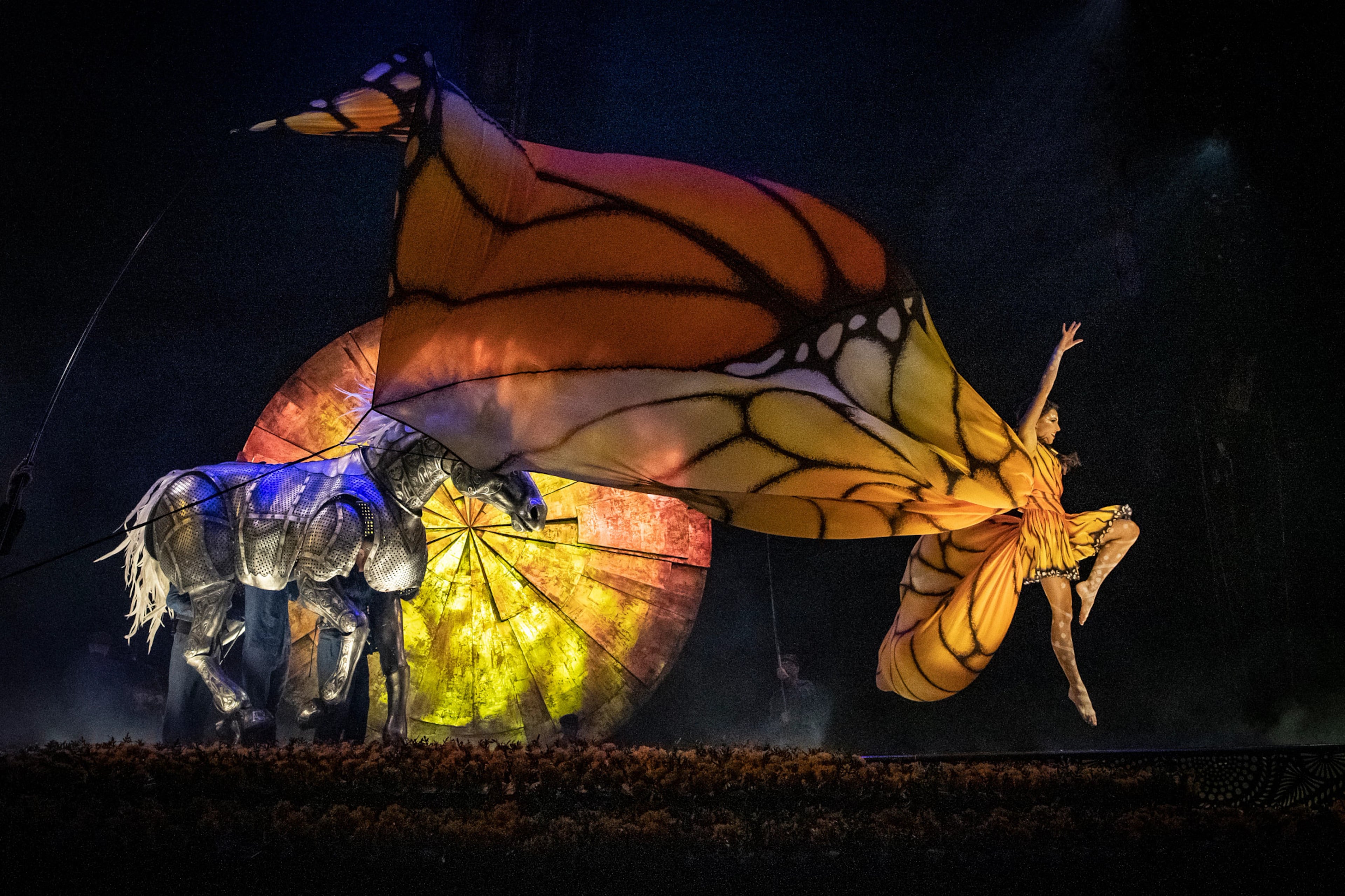 A giant treadmill used only in Cirque du Soleil's production of “Luzia” propels a dancer costumed as a Monarch butterfly. (Courtesy of Matt Beard and Anne Colliard)