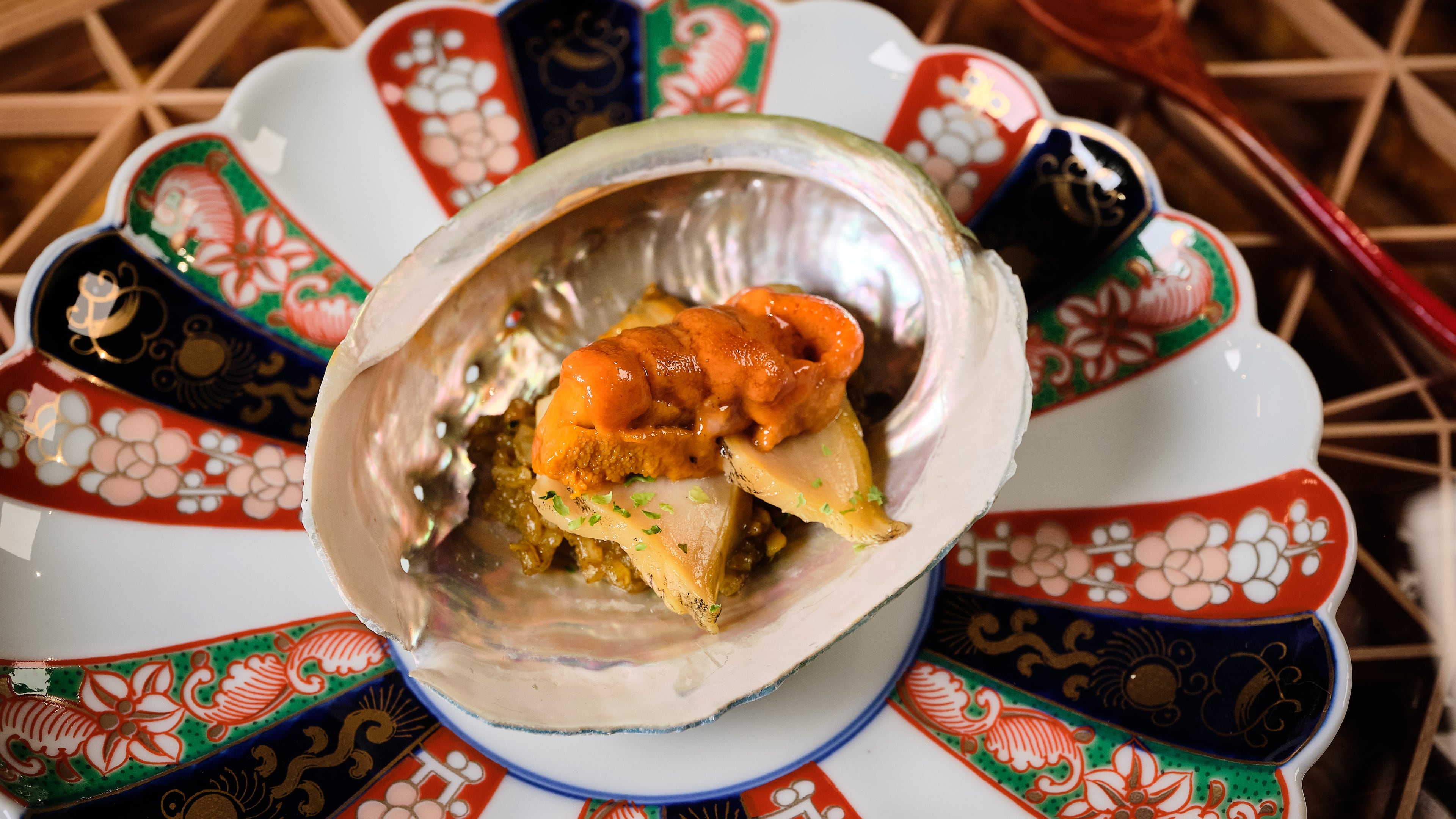 Abalone topped with uni is one of the dishes you might find served at Ryokou, which sources much of its seafood directly from Japan. (Courtesy of Brandon Amato/Ryokou)