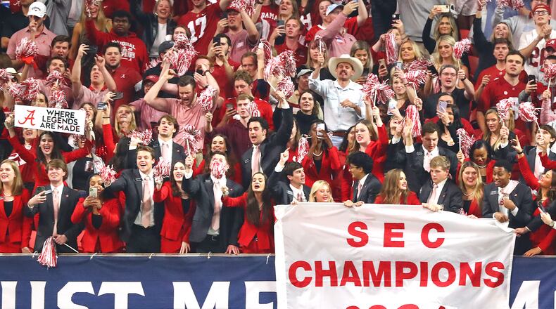 Alabama fans celebrate beating Georgia in the SEC Championship game on Dec 4, 2021, in Atlanta. (Curtis Compton / Curtis.Compton@ajc.com)
