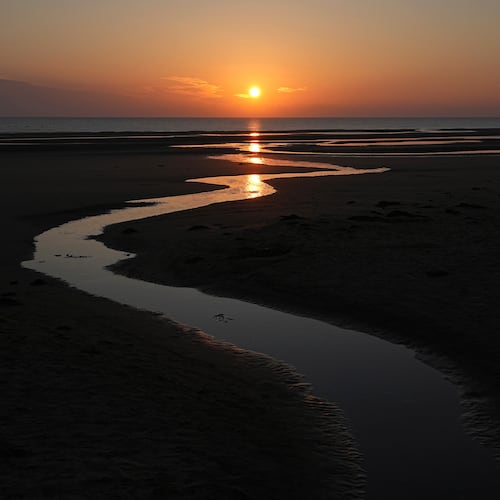 FILE - Sun rises over Omaha Beach near Colleville-sur-Mer Normandy, Thursday, June 6, 2024. (AP Photo/Laurent Cipriani, file)