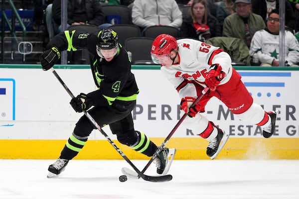 FILE - Carolina Hurricanes right wing Jackson Blake (53) trips while competing for the puck against Dallas Stars' Miro Heiskanen in the second period of an NHL hockey game in Dallas, Jan. 21, 2025. (AP Photo/Tony Gutierrez, File)