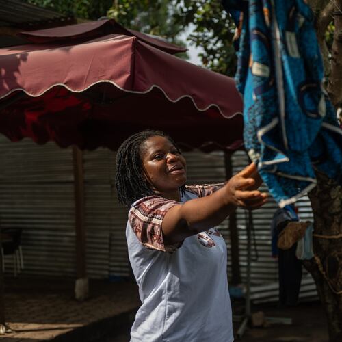 Esther Lutula, a 26 year-old woman who is four months pregnant and a mother of four who stopped going for prenatal checkups shortly after the current Ebola outbreak, does the laundry outside her house in Bunia, northeastern, Congo, Tuesday, June 16, 2026. (AP Photo/Moses Sawasawa)