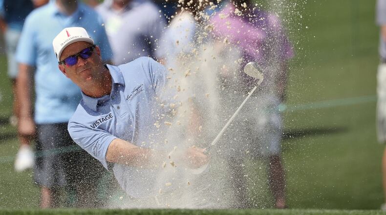 Stewart Cink hits from a bunker on the front nine during the first round of the Masters Tournament Thursday, April 11, 2019, at Augusta National Golf Club in Augusta. Jason Getz / Special to the AJC