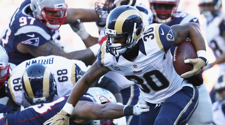 Todd Gurley of the Los Angeles Rams runs with the ball during the first half against the New England Patriots at Gillette Stadium on December 4, 2016 in Foxboro, Massachusetts. (Photo by Maddie Meyer/Getty Images)