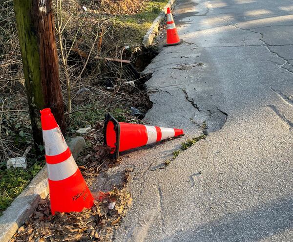 This shows the street damage in February 2022. May says the only thing the city took action on was putting up the cones, surrounding the damage.