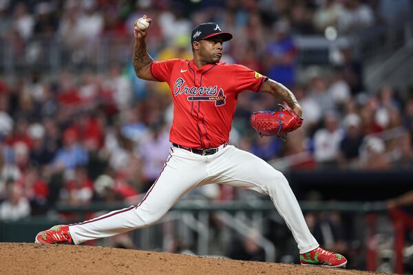 Atlanta Braves pitcher Raisel Iglesias delivers in the ninth inning of a baseball game against the Minnesota Twins, Friday, April 18, 2025, in Atlanta. (AP Photo/Colin Hubbard)