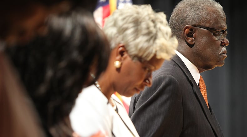 Mayor of the city of South Fulton William “Bill” Edwards takes a moment of silence. Edwards has vetoed three measures since the city was formed. (HENRY TAYLOR / AJC FILE PHOTO)