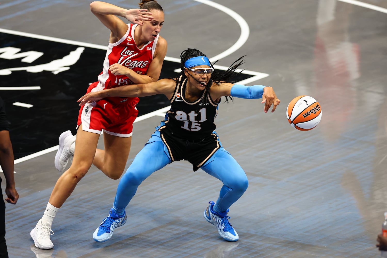 Atlanta Dream guard Allisha Gray (15) fights for a loose ball against Las Vegas Aces forward Stephanie Talbot, left, during the second half of a WNBA game at State Farm Arena on Sunday, May 17, 2026, in Atlanta. (Colin Hubbard for the AJC) 