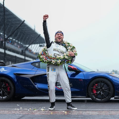 Felix Rosenqvist, of Sweden, pumps his fist at the request of track officials after winning the Indianapolis 500 auto race at Indianapolis Motor Speedway, Sunday, May 24, 2026 in Indianapolis. (AP Photo/AJ Mast)