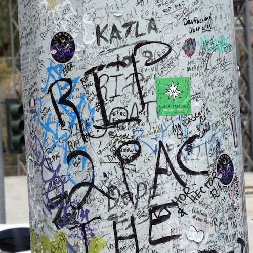 Graffiti about Tupac is seen on a pole Monday, Aug. 10, 2026, near the intersection where he was shot at in Las Vegas. (AP Photo/Ty ONeil)
