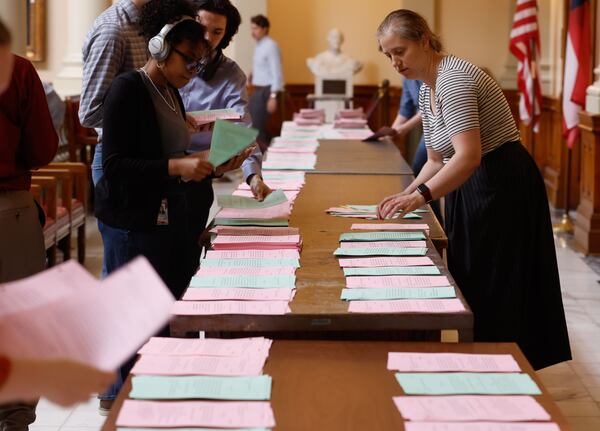 Senate legislative session crew prepare documents for lawmakers in preparation for Sine Die, the last day of the Georgia General Assembly, on Thursday, April 3, 2025. (Natrice Miller/ AJC)