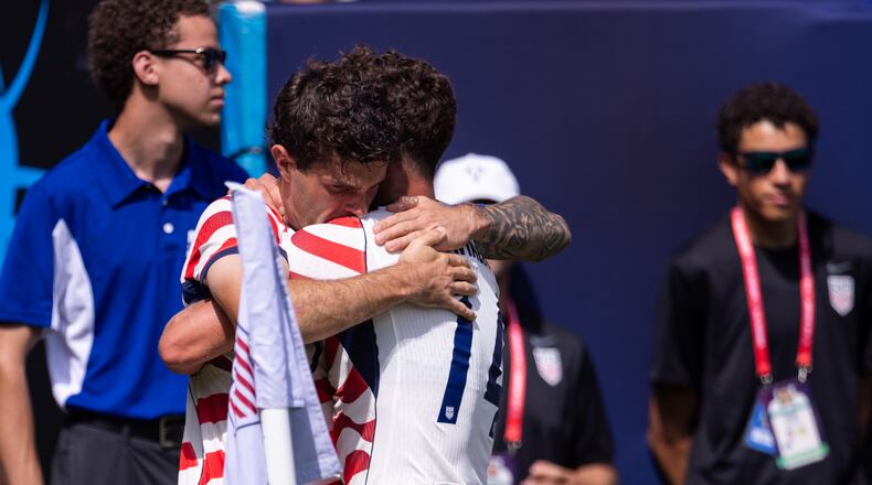 United States forward Christian Pulisic, center left, celebrates with midfielder Sebastian Berhalter (14) after scoring in the first half against Senegal in an international friendly soccer match Sunday, May 31, 2026, in Charlotte, N.C. (AP Photo/Scott Kinser)