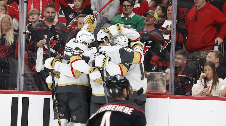 Vegas Golden Knights celebrate a goal by Tomas Hertl, during the third period in Game 1 of the NHL hockey Stanley Cup Final series against the Carolina Hurricanes in Raleigh, N.C., Tuesday, June 2, 2026. (AP Photo/Karl DeBlaker)