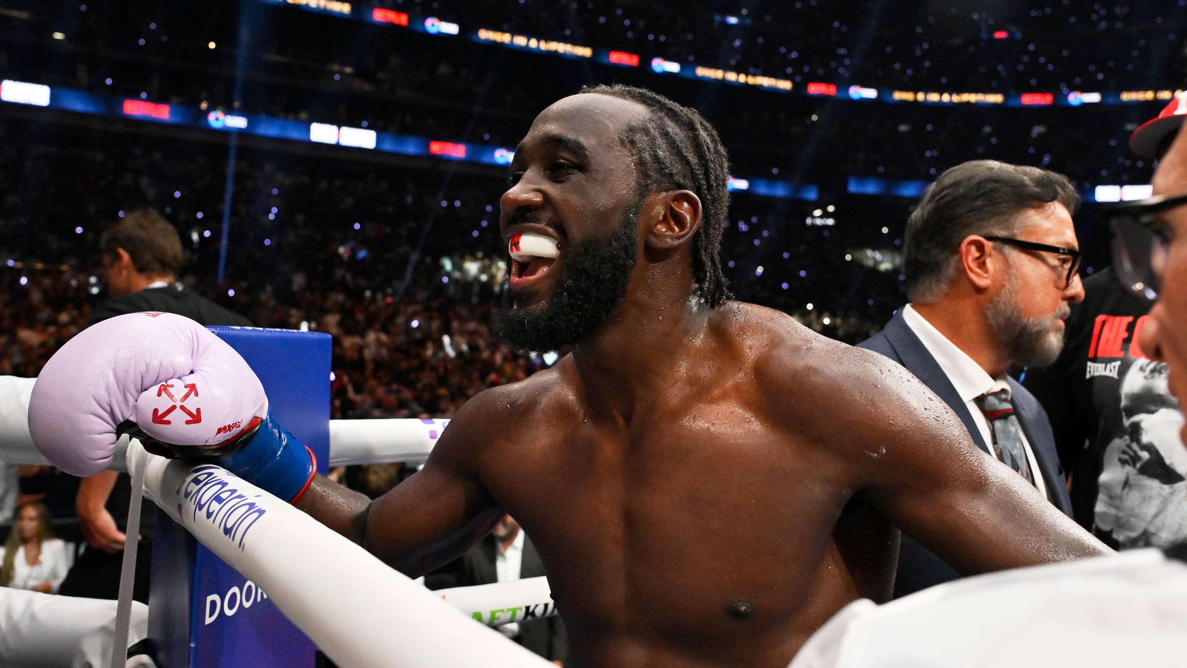 Terence Crawford celebrates after defeating Canelo Alvarez by unanimous decision in an undisputed super middleweight championship boxing match in Las Vegas, Saturday, Sept. 13, 2025. (AP Photo/David Becker)