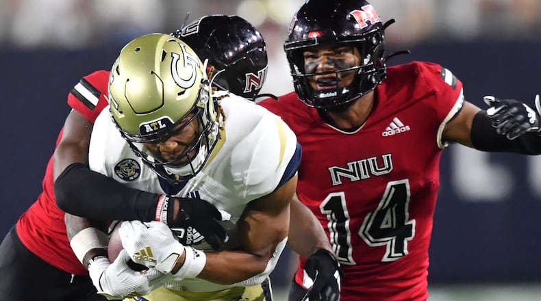 Georgia Tech wide receiver Malachi Carter (7) is tackled by Northern Illinois safety CJ Brown (6) after he made a catch during the second half Saturday, Sept. 4, 2021, at Bobby Dodd Stadium in Atlanta. Northern Illinois won 22-21. (Hyosub Shin / Hyosub.Shin@ajc.com)