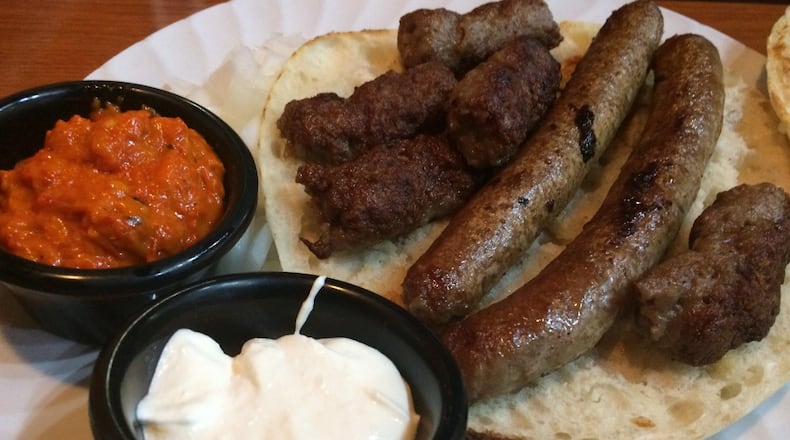 Minced meat kebabs (cevapcici) and spicy beef links (sudzukice) are served tucked inside pita sandwiches at Euro Gourmet Grill. Take off the top piece of bread and dress the sandwich with condiments to your liking: chopped onion, roasted red pepper sauce and sour cream-ricotta spread. CONTRIBUTED BY WENDELL BROCK