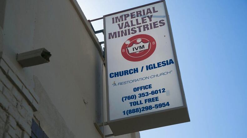 A dozen leaders of a California-based church have been indicted by a grand jury on charges that they forced homeless people to labor for the church's benefit.