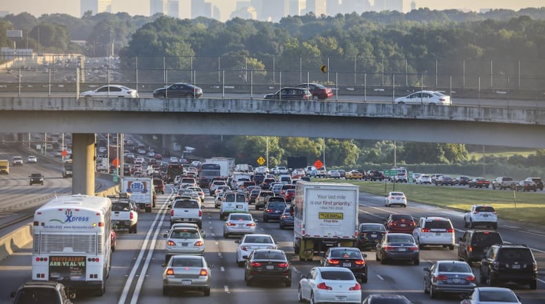The Atlanta skyline loomed overhead as northbound traffic crawls along the connecter past Arthur B. Langford Parkway. Southside commuters riding into Atlanta experienced unusual long delays on Thursday, Aug. 25, 2016 starting with a crash at 5:59 a.m. that took up 3-center northbound lanes that caused heavy delays on I-75 at I-285 in Clayton County. The crash kept cars at a crawl from Jonesboro Rd./Hwy 54 according to the WSB 24-hour Traffic Center. Following that crash just before 7 a.m. a rollover crash on the I-75 / I-85 connector between Fair Drive and University Avenue further exacerbated traffic flow. Officials offered no additional details concerning the crashes. JOHN SPINK /JSPINK@AJC.COM