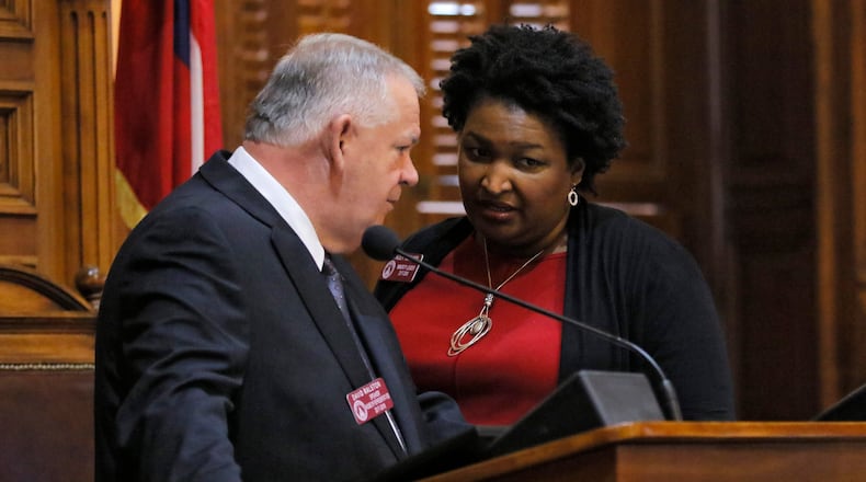 Speaker David Ralston confers with then-House Minority Leader Stacey Abrams in this 2017 file photo. BOB ANDRES /BANDRES@AJC.COM