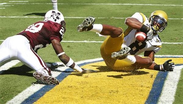 Georgia Tech wide receiver Demaryius Thomas catches a pass in the end zone past Mississippi State defensive back Tay Bowser.