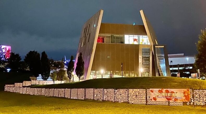 Five thousand broken hearts, representing Georgians who have lost their lives to COVID-19, form the “Loved Ones, Not Numbers Memorial Wall” around the National Center for Civil and Human Rights in Atlanta.