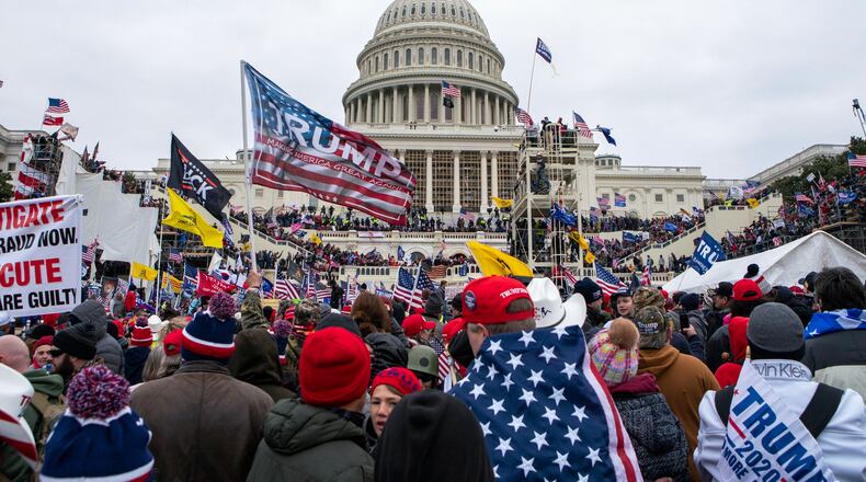 FILE - Rioters loyal to President Donald Trump rally at the U.S. Capitol in Washington on Jan. 6, 2021. (AP Photo/Jose Luis Magana, File)
