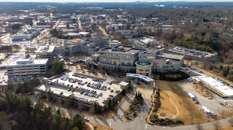 For frontline workers at Gainesville's Northeast Georgia Medical Center, the last two weeks have been the most deadly in the COVID-19 battle. Yet in the city beyond, an estimated 30% of residents still aren't wearing face coverings in public. (Hyosub Shin / Hyosub.Shin@ajc.com)