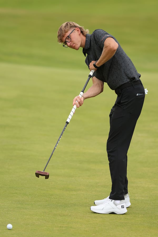 Richard Teder of Estonia putts on the 1st green during a practice round for the British Open golf championship at the Royal Portrush Golf Club, Northern Ireland, Tuesday, July 15, 2025. (AP Photo/Peter Morrison)